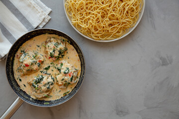 Homemade Creamy Tuscan Chicken with Spinach, top view. From above, overhead, flat lay. Copy space.