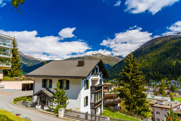 Fototapeta na wymiar Houses in town village in Alps mountains, Davos, Graubuenden, Switzerland