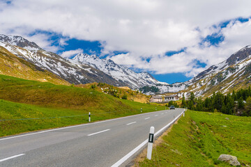 Fototapeta premium Road with Alps mountains, Samedan, Maloja Graubuenden Switzerland