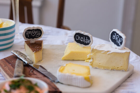 cheeses with cute handwritten tags