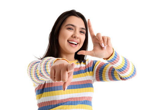 Young woman showing loser gesture on white background, closeup