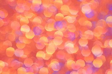 Orange, yellow, gold and purple abstract background. Bright sparkle and glow of brilliant color for festive backdrop. Beautiful pastel pattern, cheerful glowing colors.