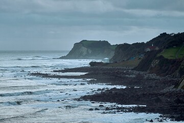 Rocky coastline against a cloudy sky in Ventnor, Isle of Wight, England
