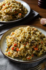Rice with Mushrooms, Chicken, and Vegetables, Risotto, Comfort Food, Healthy Meal on Rustic Background