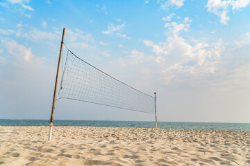 empty volleyball net on the tropical beach with blue sky. beach sport.