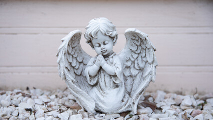 A carved figure of a white angel.