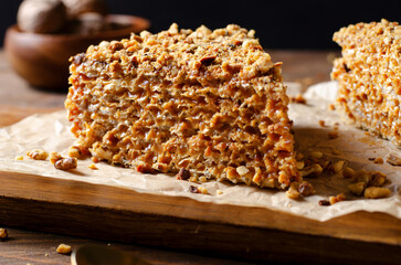 Wafer Cake with Condensed Milk and Nuts, Layered Cake on Wooden Background
