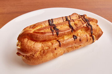Custard pie with meringue filling on a white plate.