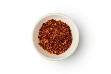 Cayenne pepper powder in white bowl isolated on white background with clipping path.Top view