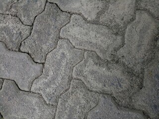 cracked and dirty brick paving roads