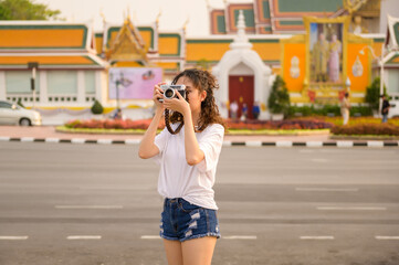 Beautiful young Asian tourist woman on vacation sightseeing and exploring Bangkok city, Thailand, Holidays and traveling concept