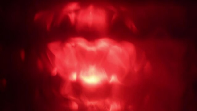 Red blurred abstract texture with glowing fire light