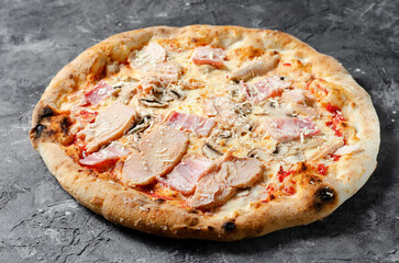 Frozen Chicken, Bacon, Mushroom Pizza on Dark Background, Stone Baked Pizza Ready to Bake