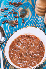 Healthy bean soup with red beans, Homemade Soup on blue wooden background , Vegetarian Food.