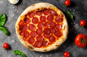 Pepperoni Pizza with Mozzarella Cheese, Salami, Tomato Sauce on Dark Background, Freshly Baked Pizza