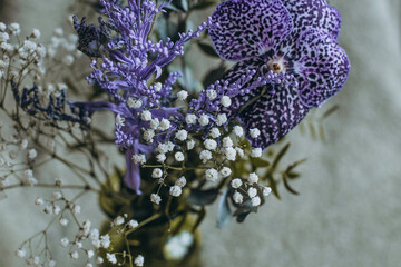 still life green vase with purple flowers