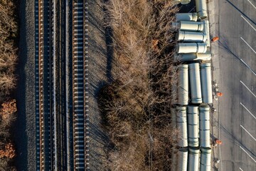 Aerial shot of train tracks with construction pipes and tubes