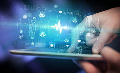 Close-up of a touchscreen with healthcare icons