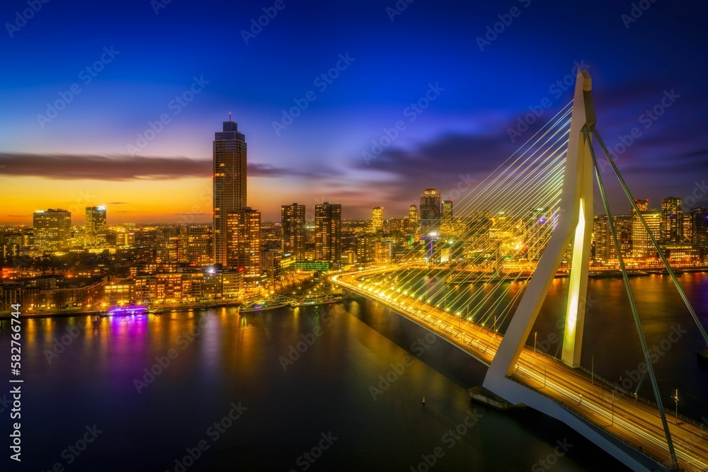 Poster Scenic view of highrise buildings and city skyline with lights during dusk