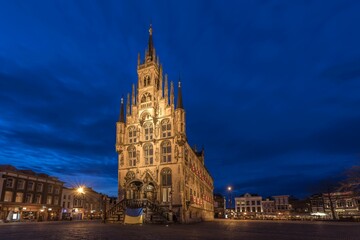 Fototapeta na wymiar Scenic view of the City Hall of Gouda in the Netherlands during nighttime