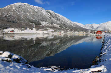View of the village of Skei and lake Jolstravatnet, in Sunnfjord Municipality, Vestland county, Norway. Scenic landscape in winter, with reflections on the water.
