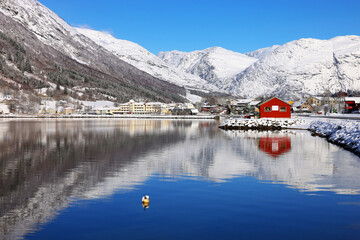 View of the village of Skei and lake Jolstravatnet, in Sunnfjord Municipality, Vestland county, Norway. Scenic landscape in winter, with reflections on the water.	
