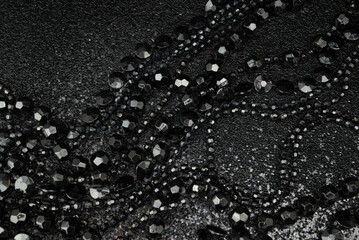 Beautiful black bead necklaces on a black background