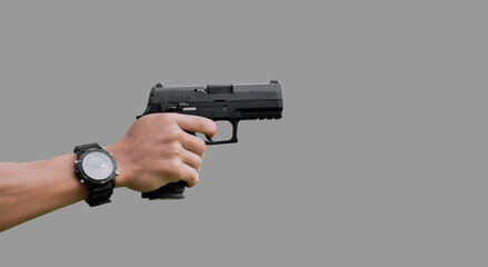 Isolated automatic 9mm pistol gun  holding in hand of shooter with clipping paths.