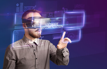 Businessman looking through Virtual Reality glasses, tech concept