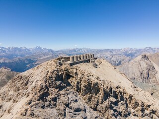 Beautiful view of ruined artillery batteries with people in Mont Chaberton peak