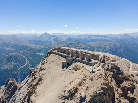 Beautiful view of ruined artillery batteries with people in Mont Chaberton peak