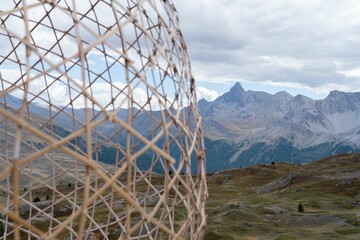 Closeup of the straw circle decoration on the valley surrounded by rocky mountains in the daytime