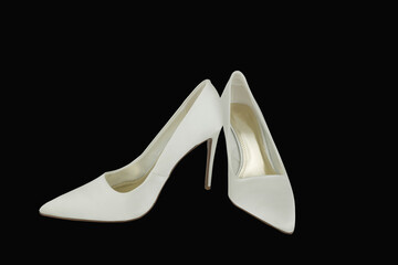 on background beautiful white  wedding shoes
