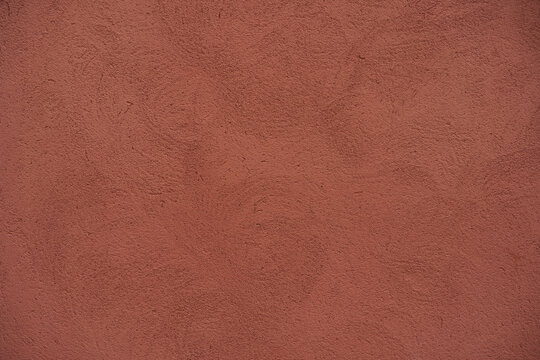 High resolution clay colored wall texture background, pattern, collage, wrapping paper, wallpaper... Image of textured stucco in matte terracotta color.