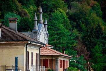 Beautiful buildings of Argegno with trees behind it in Italy