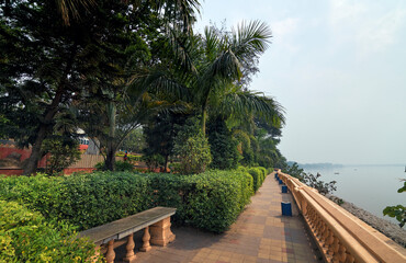 Fototapeta na wymiar Beautifully decorated public park with lush green surroundings along the banks of Ganges river at Halisahar, West Bengal. Popularly known as Craig Park, this park is a popular travel spot.