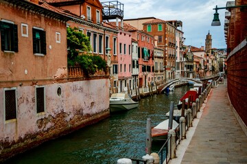 Fototapeta na wymiar Beautiful canal and historic buildings on the banks in Venice, Italy