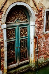 Nice old door in streets of Venice, Italy