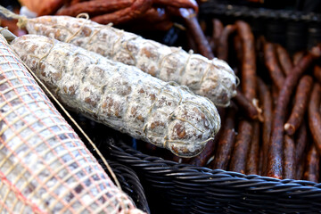 Various home made game meat specialties prepared and smoked, presented at a hunting fair.