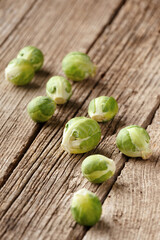 Brussels sprouts on a wooden background.