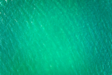 Aerial view of seascape surface of green sea water with small ripple waves