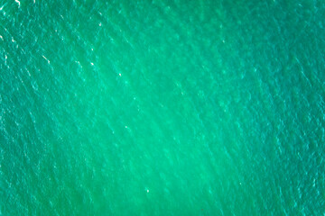 Aerial view of seascape surface of green sea water with small ripple waves