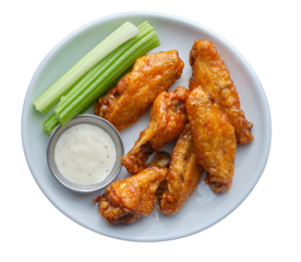 isolated spicy buffalo chicken wings on plate with celery. ranch dipping shot from top down view on transparent background