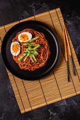 Korean traditional food, cucumber and boiled egg cold spicy noodles.