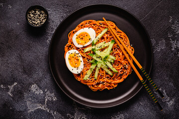 Korean traditional food, cucumber and boiled egg cold spicy noodles.