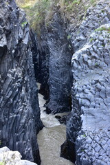stream bed of river Alcantara flowing through basalt of volcano Etna,Sicily Italy