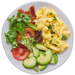 isolated keto friendly low carb breakfast plate with scrambled eggs, avocado, bacon and salad