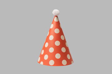 Bright and colorful birthday cap isolated on a grey background.