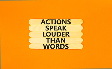 Actions speak louder words symbol. Concept words Actions speak louder than words on wooden stick....