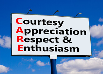 CARE symbol. Concept words CARE courtesy appreciation respect and enthusiasm on big billboard against beautiful blue sky. Business CARE courtesy appreciation respect enthusiasm concept. Copy space.